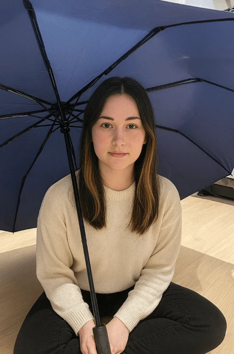 ZeroTwo AI | AI agent platform | Image of a person setting on the floor under a blue umbrella